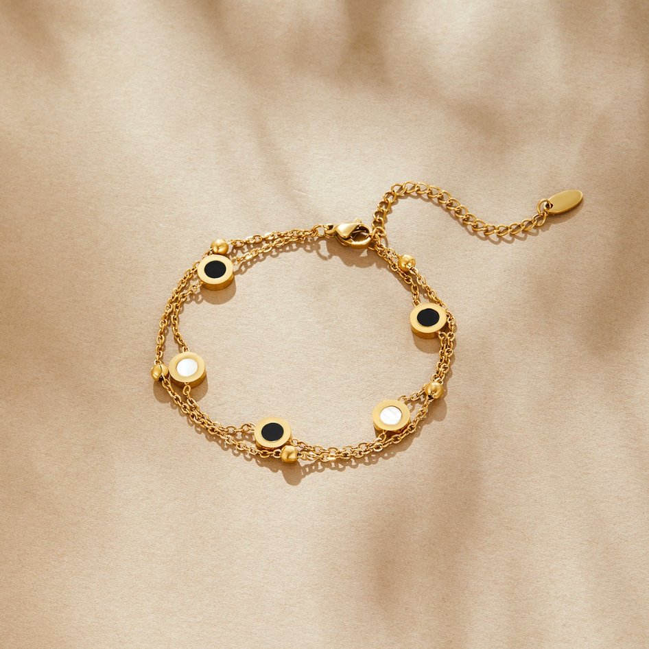Armband med onyx och vit sten